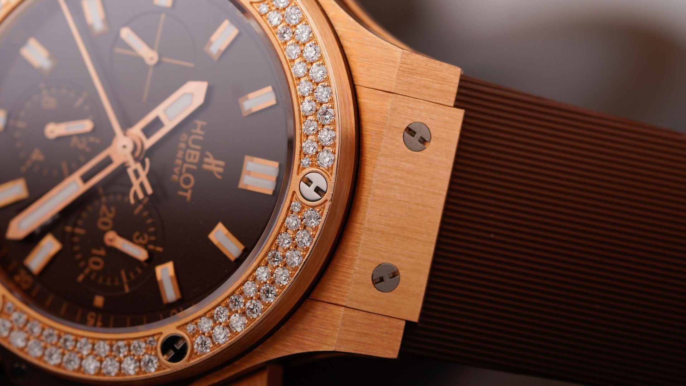 Gold-tone luxury watch case and bezel finishing detail